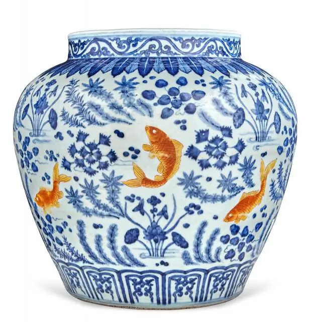 Chinese Underglazed Blue and Iron Red Porcelain Fish Jar. This potted jar is painted in the round with eight iron-red carp swimming amid lotus blossoms and water weeds. Qing Dynasty, Height 12 3/8 inches. This jar is being auctioned by Doyle New York on March 18 for an estimated $20,000 to $30,000. (Courtesy of Doyle New York)