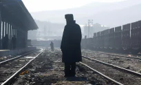 Man on Fire Lies on Railway Track, Authorities Take Photo and Walk Away