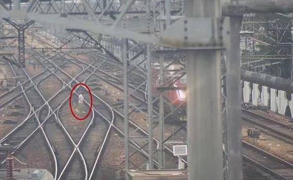 Man on railroad tracks