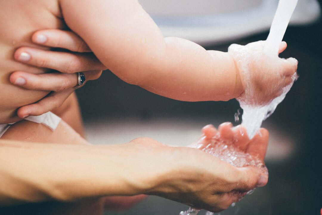 Newborns take time to develop their microbiome, with help from their mother's milk and vaginal delivery. (andres chaparro/Pexels)
