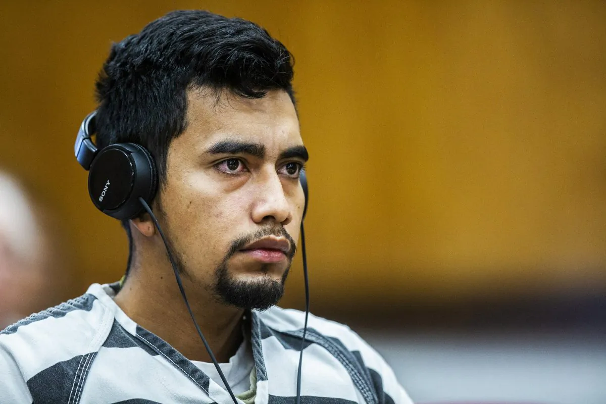 Cristhian Bahena Rivera wears headphones during his arraignment where he pleaded not guilty to the charge of first-degree murder in the death of Mollie Tibbetts at the Poweshiek County Courthouse in Montezuma, Iowa., on Sept. 19, 2018. (Kelsey Kremer/Des Moines Register via AP)