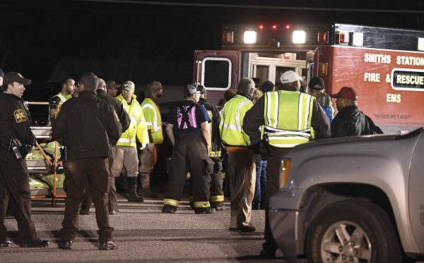 Emergency personnel work the staging area at Sanford Middle School in Beauregard, Ala.