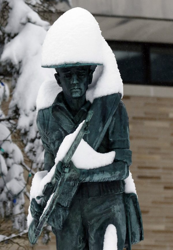 Snow covers the Spanish-American War Memorial after an overnight snowstorm