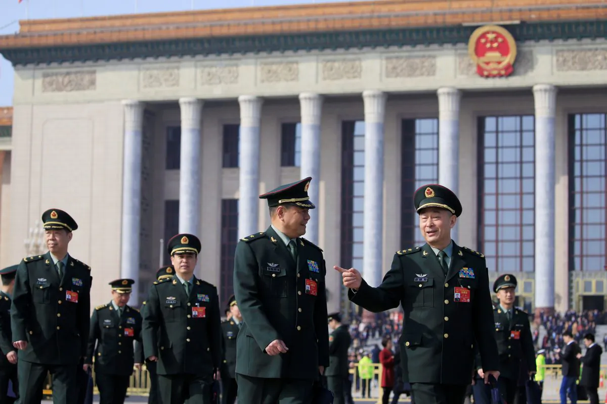 Military delegates leave the Great Hall of the People after a meeting ahead of National People's Congress (NPC), China's annual meeting of the Chinese Communist Party's political advisory body, at the Great Hall of the People in Beijing on March 4, 2019. (Aly Song/Reuters)