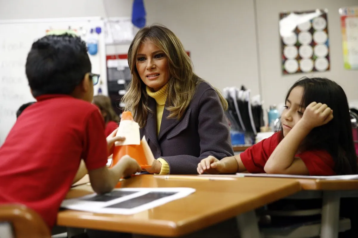 First Lady Melania Trump visits with students in a classroom at Dove School of Discovery in Tulsa, Okla., on March 4, 2019. (AP Photo/Patrick Semansky)
