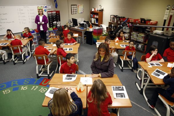 First lady Melania Trump visits with students in a classroom