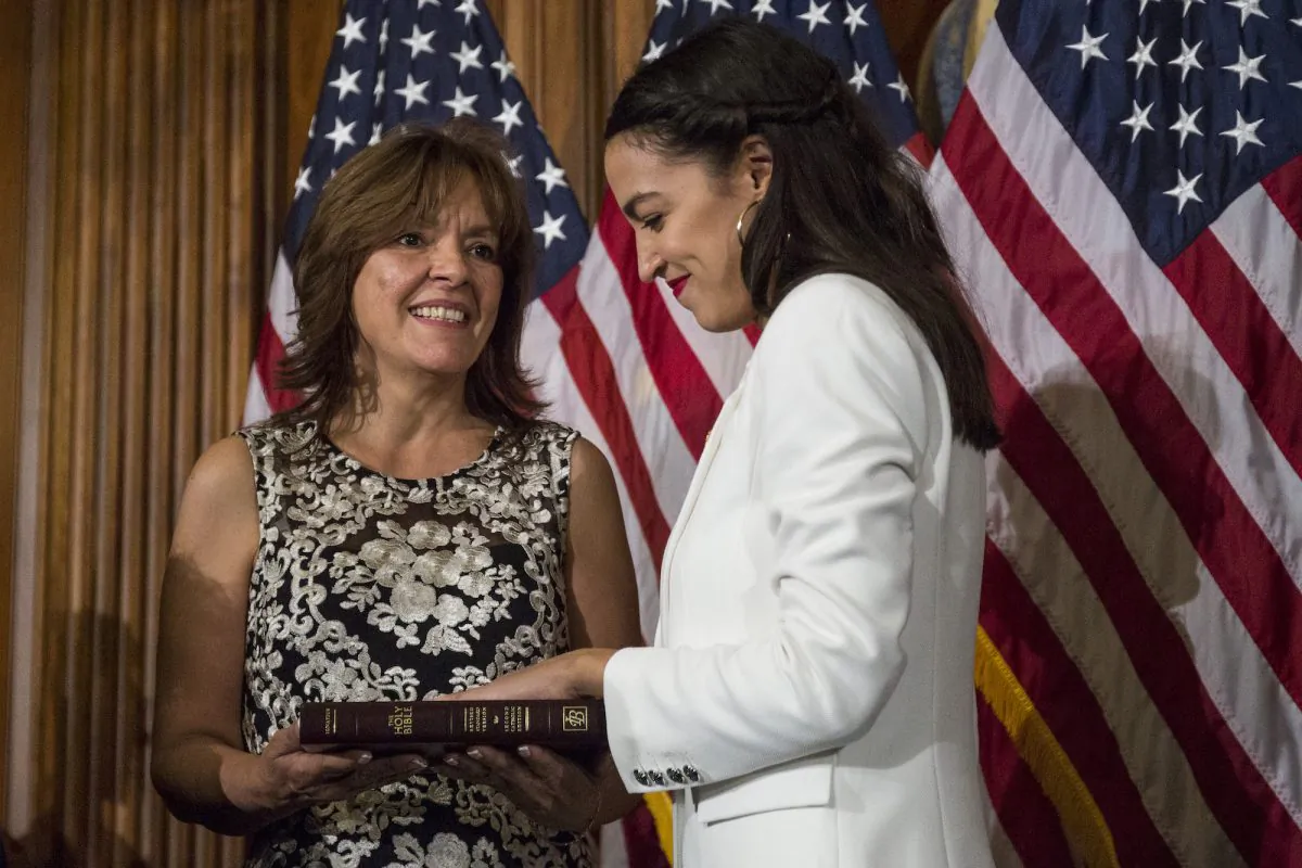 Rep. Alexandria Ocasio-Cortez (D-NY) takes part in a ceremonial mock swearing in ceremony with her mother, Blanca Ocasio-Cortez on Capitol Hill on January 3, 2019 in Washington, DC. (Zach Gibson/Getty Images)