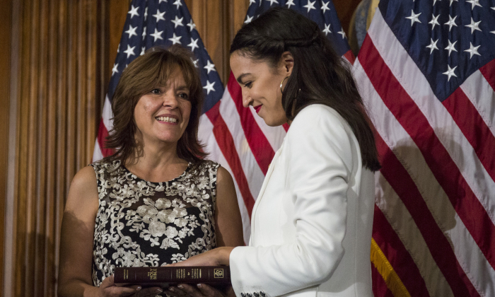Rep. Alexandria Ocasio-Cortez (D-NY) takes part in a ceremonial mock swearing in ceremony with her mother, Blanca Ocasio-Cortez on Capitol Hill on January 3, 2019 in Washington, DC. (Zach Gibson/Getty Images)