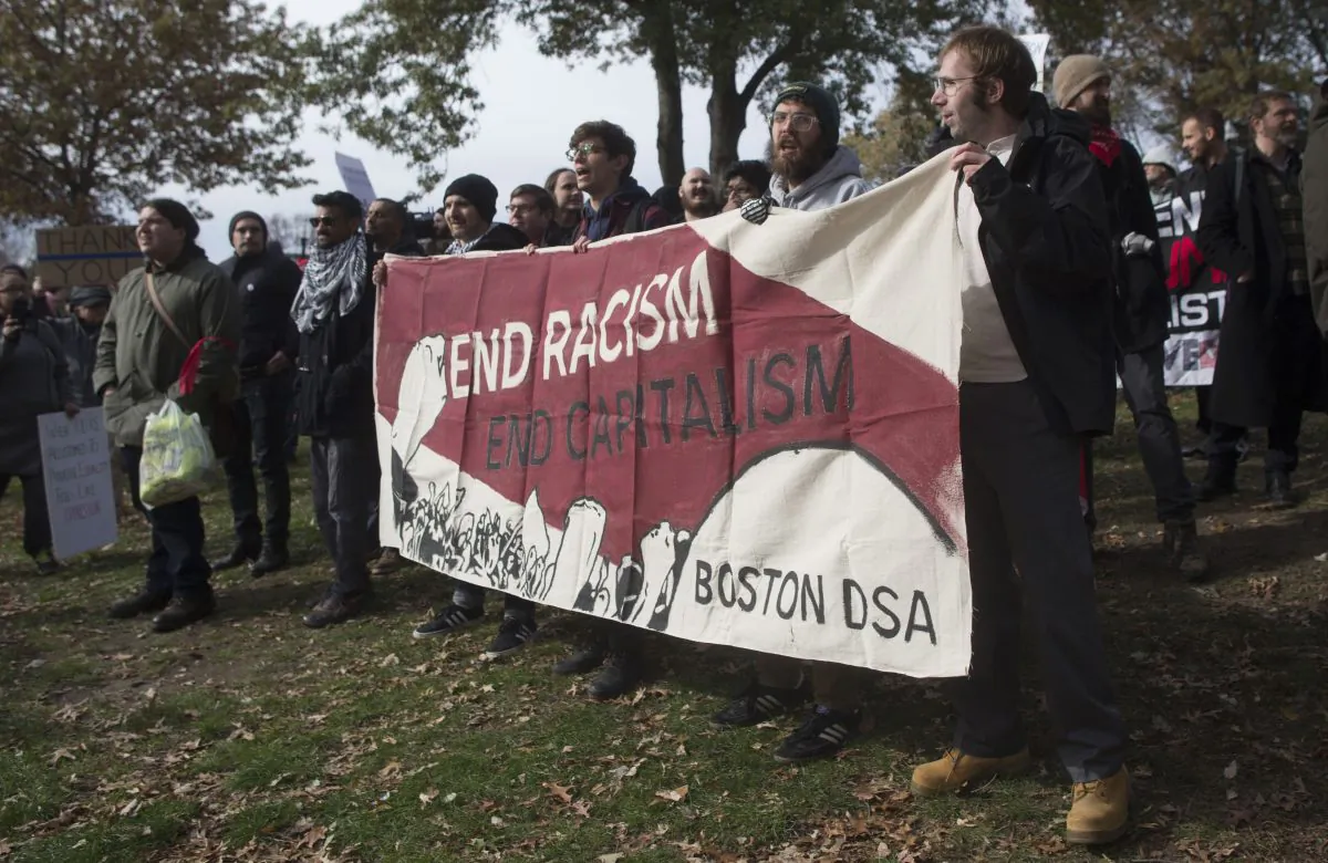 Counter-protesters of an event organized by conservative groups Resist Marxism and Boston Free Speech chant and hold up signs in Boston, on Nov. 18, 2017. (Scott Eisen/Getty Images)