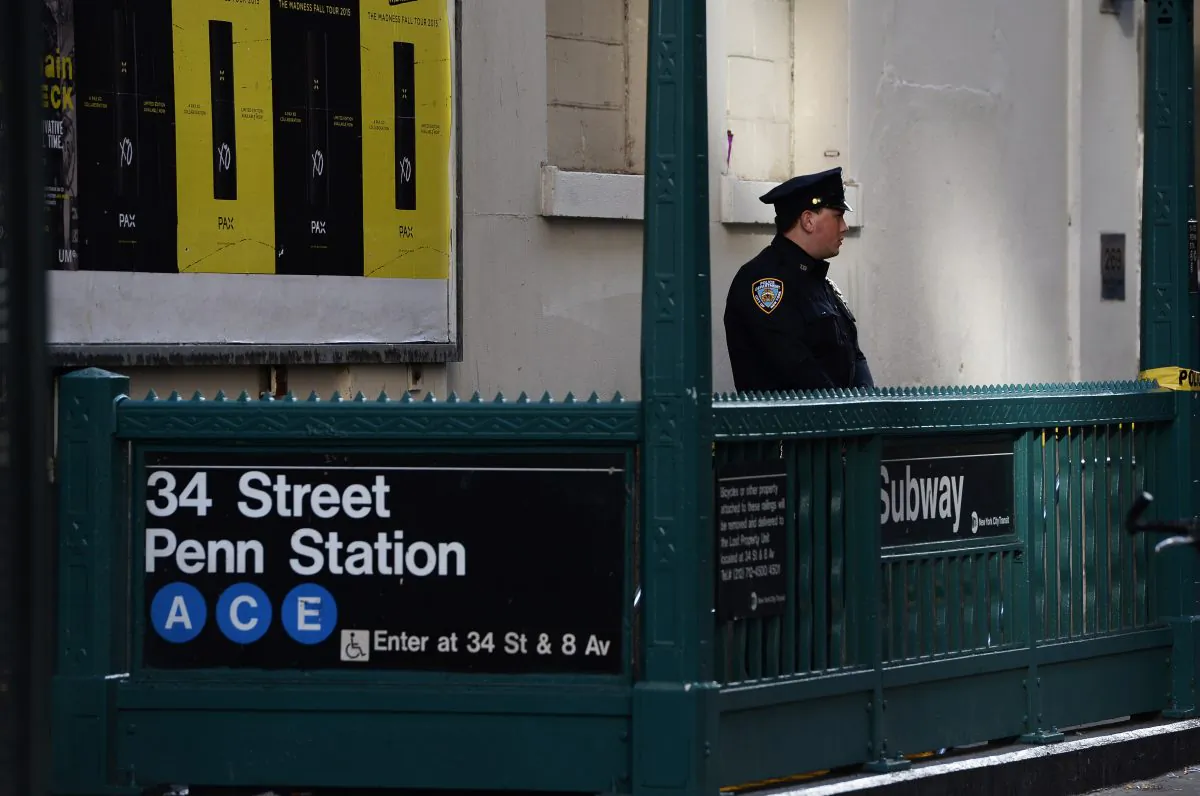 FILE—A New York Police Department (NYPD) officer securing the entrance of the 34 St. Penn Station subway station following a shooting incident in New York City on Nov. 9, 2015. (Jewel Samad/AFP/Getty Images)