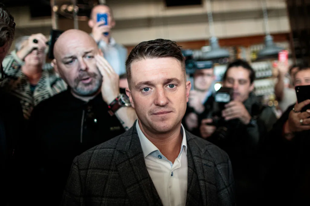 Tommy Robinson (C), real name Stephen Yaxley-Lennon is surrounded by supporters and media in a bar after his case was adjourned in London, England, on Sept. 27, 2018. (Jack Taylor/Getty Images)