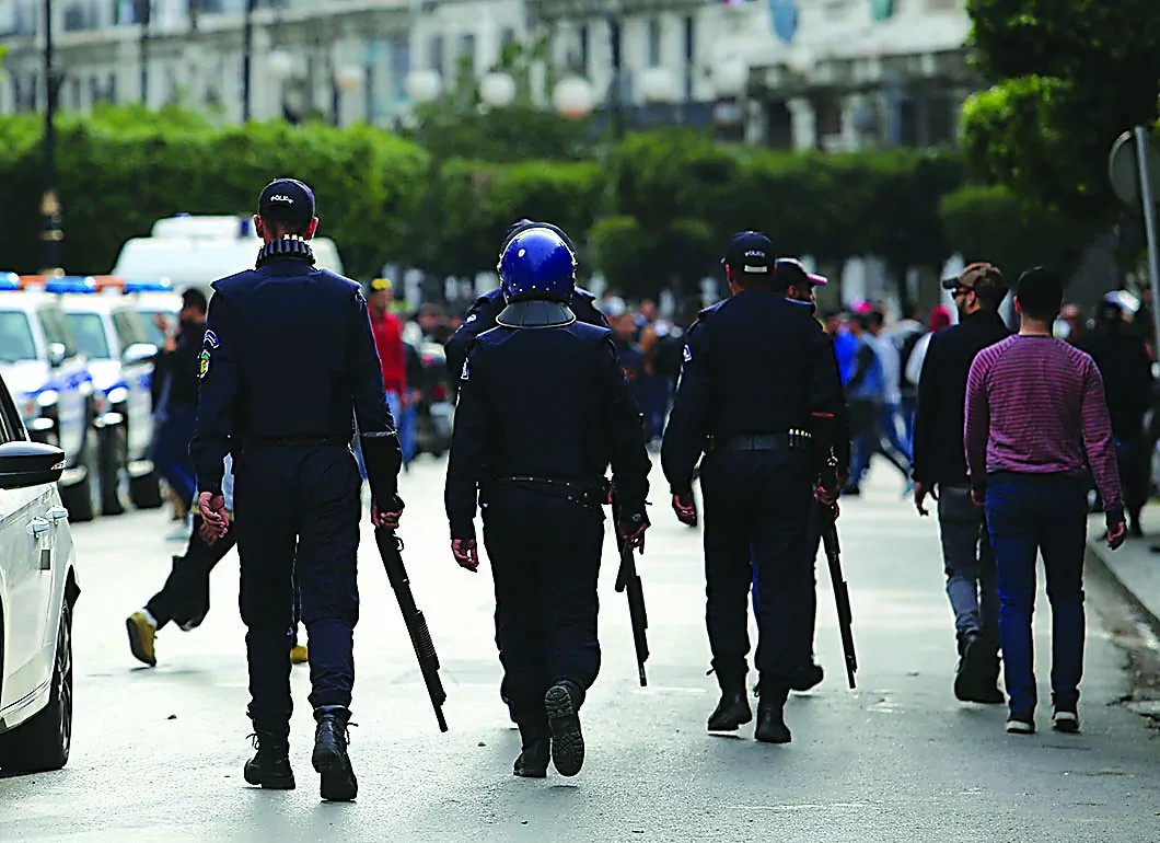 Riot police walk as they try to disperse people during the protest to denounce an offer by President Abdelaziz Bouteflika to run in elections next month but not to serve a full term if re-elected, in Algiers, Algeria March 5, 2019. REUTERS/Ramzi Boudina