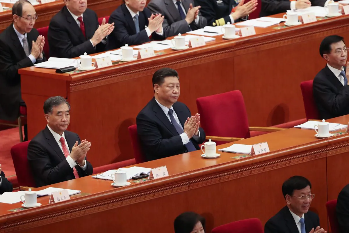 BEIJING, CHINA - MARCH 05: Chinese President Xi Jinping claps hands at Chinese Premier Li Keqiang's speech during the opening of the Two Sessions of the 13th National People's Congress (NPC) at The Great Hall of the People on March 5, 2019 in Beijing, China. (Photo by Andrea Verdelli/Getty Images)