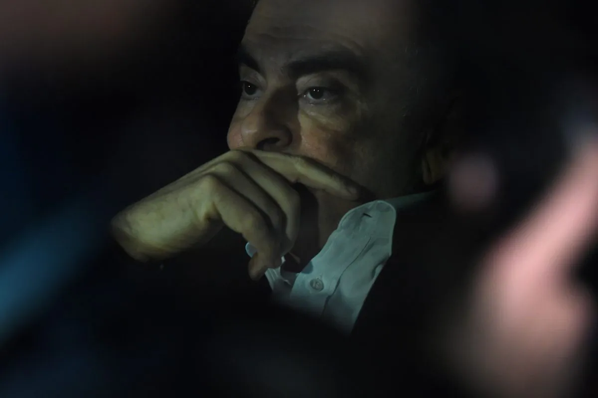 Former Nissan chairman Carlos Ghosn leaves his lawyers' offices after he was released earlier in the day from a detention centre after posting bail in Tokyo on March 6, 2019. - Former Nissan chief Carlos Ghosn left his Tokyo detention centre on March 6 after more than 100 days in custody, following a shock court decision granting him bail of one billion yen ($9 million). (Photo by Kazuhiro NOGI / AFP)        (Photo credit should read KAZUHIRO NOGI/AFP/Getty Images)
