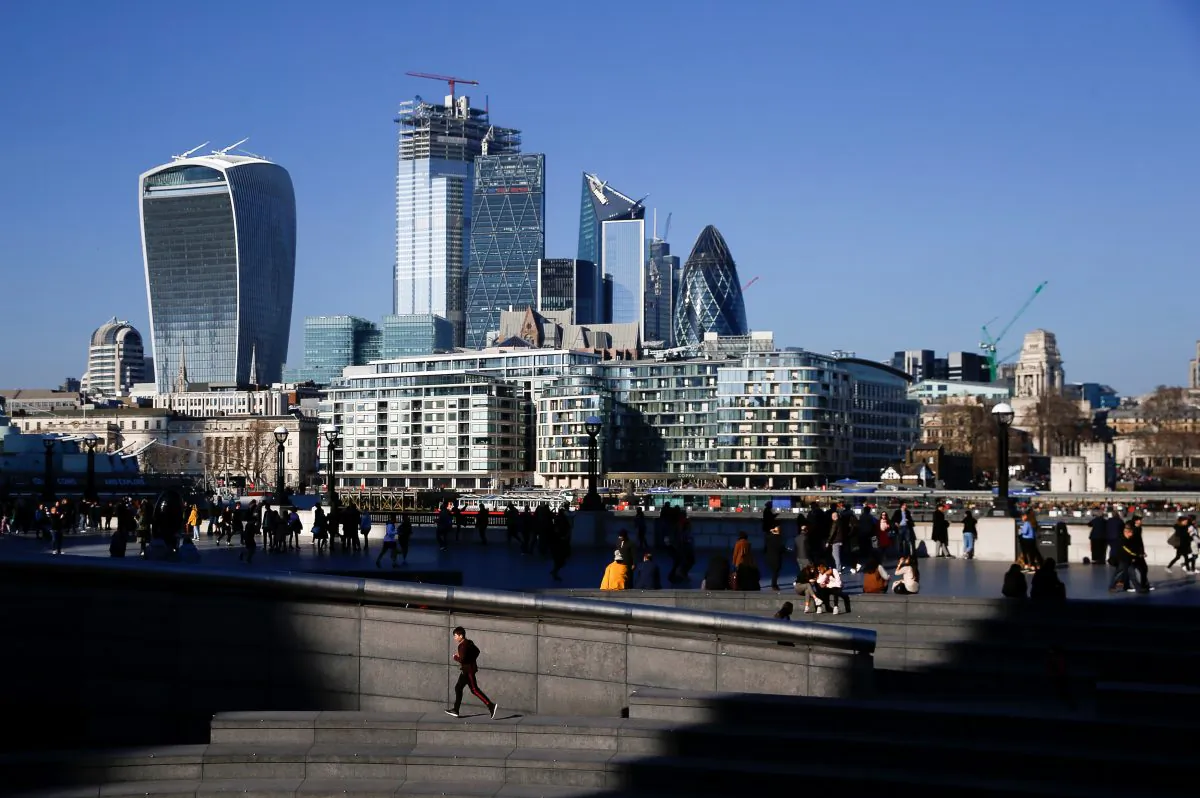 The financial district can be seen as a person runs in the sunshine on London's south bank, Britain on Feb. 23, 2019. (Henry Nicholls/Reuters)
