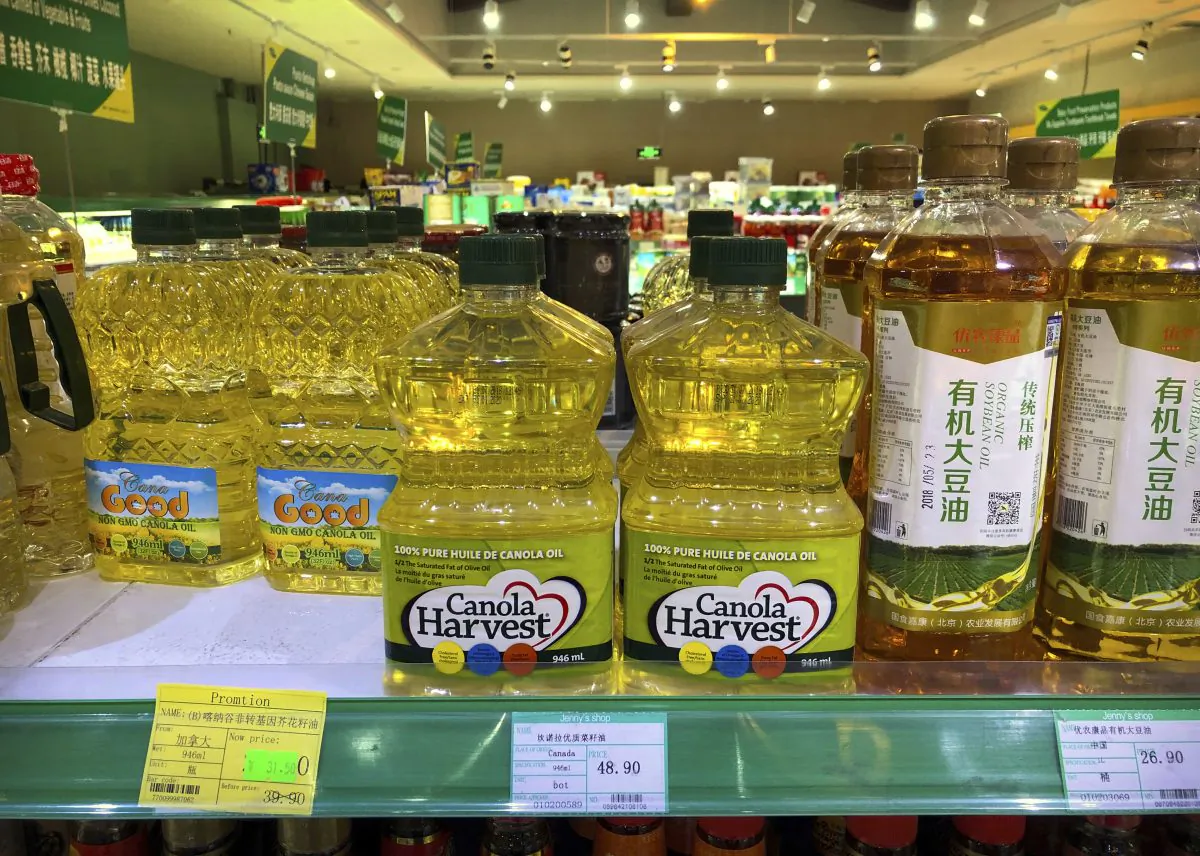 Bottles of Canola Harvest brand canola oil, manufactured by Canadian agribusiness firm Richardson International, are seen on the shelf of a grocery store in Beijing on March 6, 2019. One of Canada's largest grain processors said on March 5 that China has revoked its permit to export canola there, a move that some saw as retaliation for the Canadian government's arrest of a top executive for the Chinese tech giant Huawei. (Mark Schiefelbein/AP)