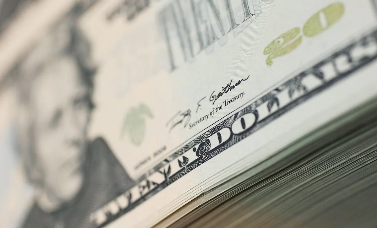 File photo of a stack of new 20-dollar bills bearing Treasury Secretary Timothy Geithner’s signature at the Bureau of Engraving and Printing in Washington, DC, on July 22, 2011. (Mark Wilson/Getty Images)