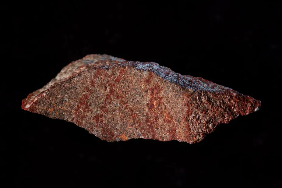 The drawing found on silcrete stone in Blombos Cave. (Craig Foster)