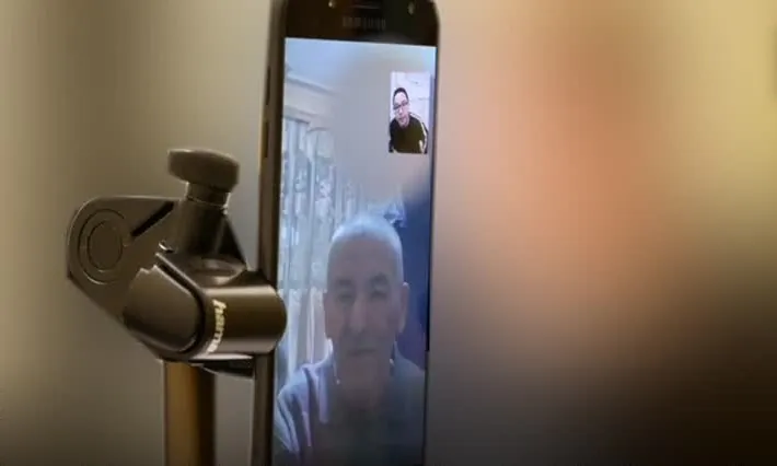 Uyghur Tahir Mutallip Qahiri receives a call from his father, a prominent retired Uyghur scholar and professor in Xinjiang, after they had been out of contact for 17 months. (Tahir Qahiri)