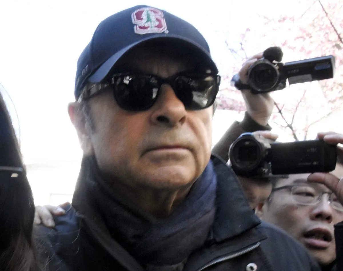 Former Nissan chairman Carlos Ghosn walks on a street in Tokyo, on March 8, 2019. (Kyodo News via AP)