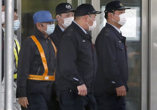 Ghosn walks on street 2