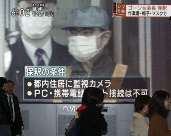 Ghosn walks on street