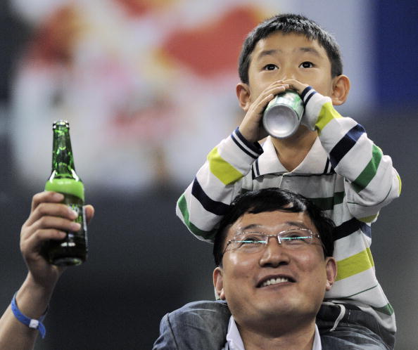 Man and boy drinking