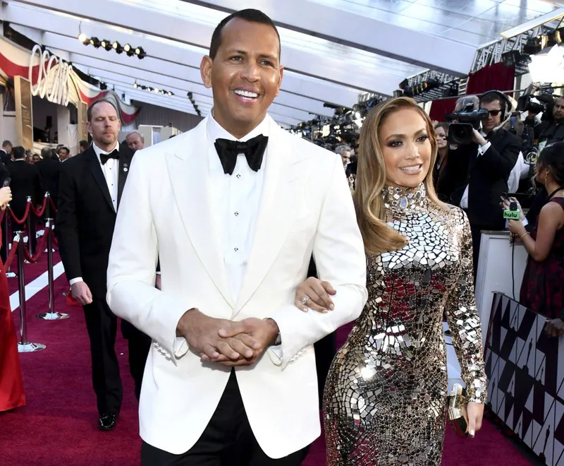 Alex Rodriguez, left, and Jennifer Lopez arrive at the Oscars at the Dolby Theatre in Los Angeles on Feb. 24, 2019. (Charles Sykes/Invision/AP)