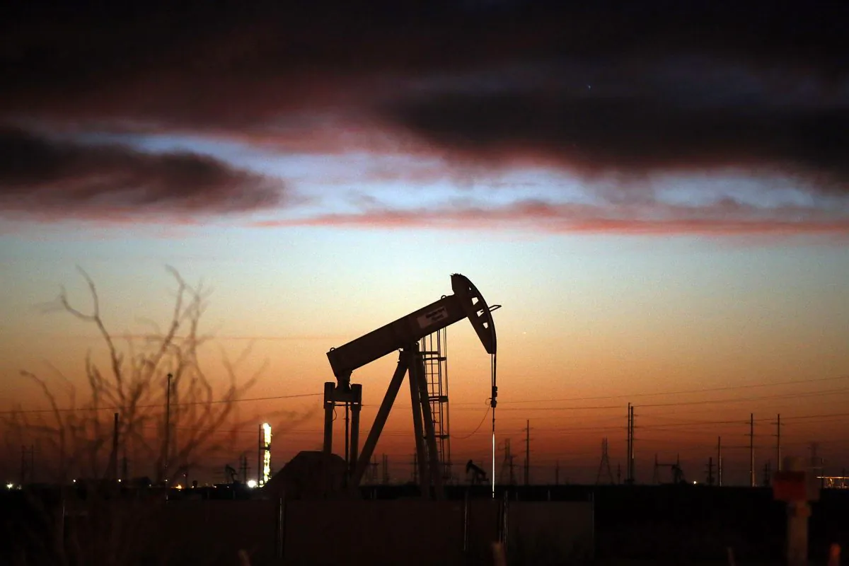 An oil pumpjack works at dawn in the Permian Basin oil field on January 20, 2016 in the oil town of Andrews, Texas. (Spencer Platt/Getty Images)