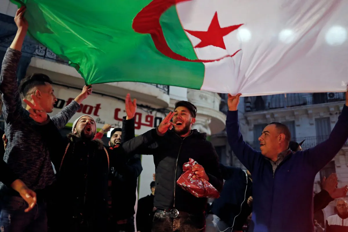 People celebrate on the streets after President Abdelaziz Bouteflika announced he will not run for a fifth term, in Algiers, Algeria March 11, 2019. REUTERS/Zohra Bensemra