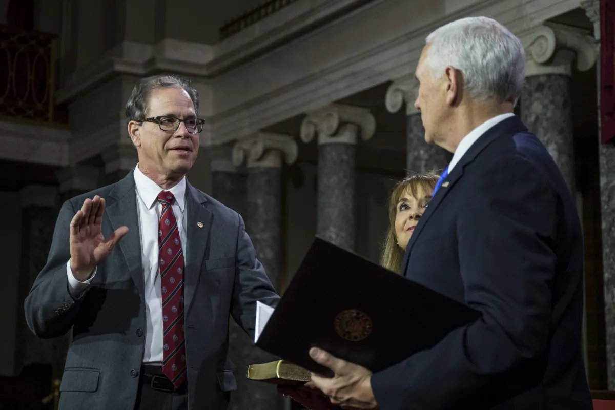 Sen. Mike Braun (R-Ind.) participates in a mock swearing in ceremony with Vice President Mike Pence on Capitol Hill in Washington on Jan. 3, 2019. (Zach Gibson/Getty Images)