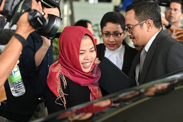 Indonesian national Siti Aisyah (C) smiles while leaving the Shah Alam High Court,
