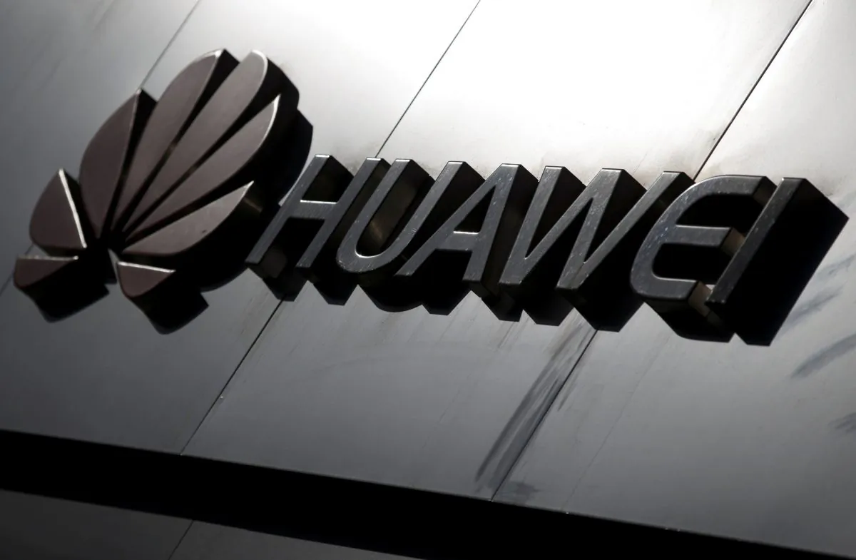 The Huawei brand logo is seen above a store of the telecoms equipment maker in Beijing on March 7, 2019. (Thomas Peter/Reuters)