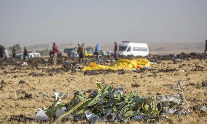 Airplane parts lie on the ground at the scene of an Ethiopian Airlines flight crash near Bishoftu, or Debre Zeit, south of Addis Ababa, Ethiopia, March 11, 2019. (AP Photo/Mulugeta Ayene)