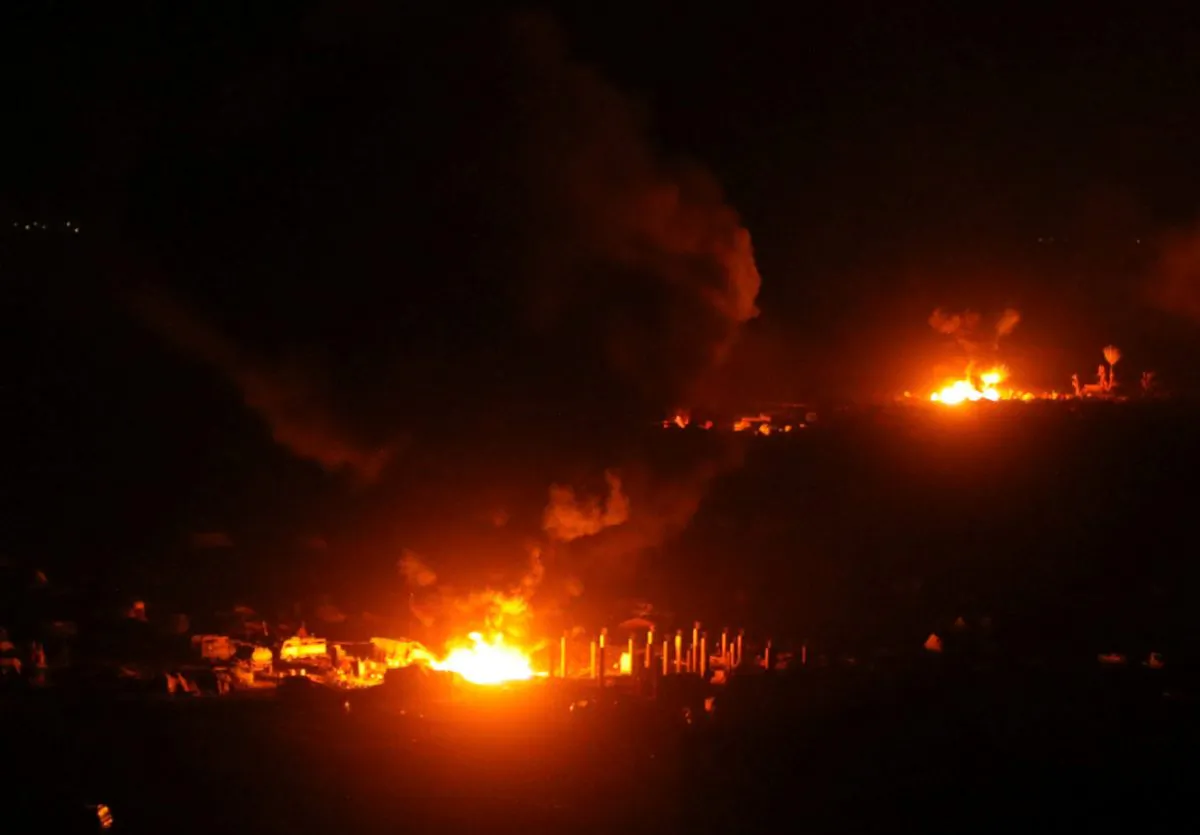 Fire and plumes of smoke are seen during fighting in the Islamic State's final enclave, in the village of Baghouz, Deir Al Zor province, Syria March 11, 2019. REUTERS/Rodi Said