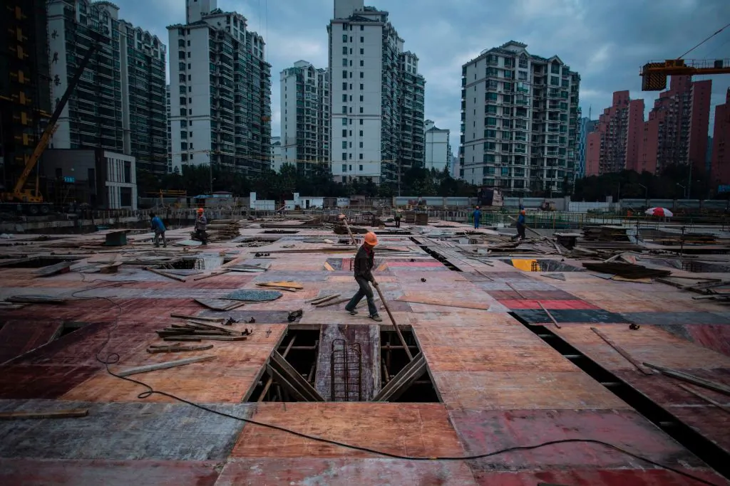 A man works at a construction site of a residential skyscraper in Shanghai. (JOHANNES EISELE/AFP/Getty Images)