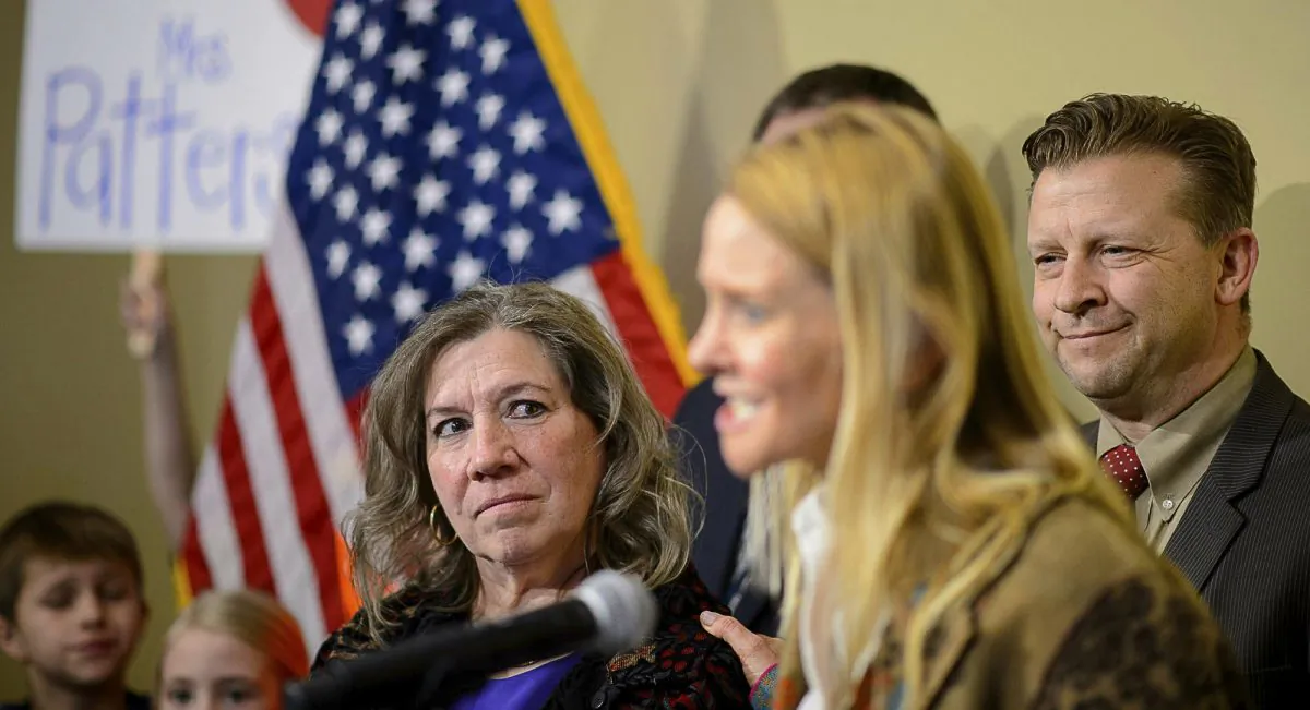 Valley View Elementary School teacher Moana Patterson listens as Tiffany Ivens-Spence speaks at a news conference by parents and students to show support for Patterson, in Salt Lake City, Monday, Mar. 11, 2019.(Trent Nelson/The Salt Lake Tribune via AP)
