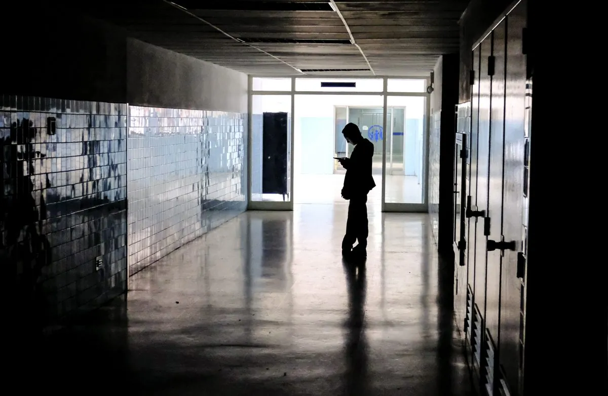 A man stands on a dark corridor at Miguel Perez Carreno hospital, in Caracas, during the worst power outage in Venezuela's history, on March 8, 2019. (Matias Delacroix/AFP/Getty Images)