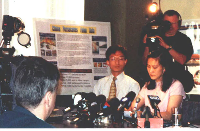 Ying Zhu (R) speaks about her ordeal in China at a press conference in Montreal on June 22, 2001, soon after she returned to Canada. Over 20 media outlets were represented at the press conference. (The Epoch Times)