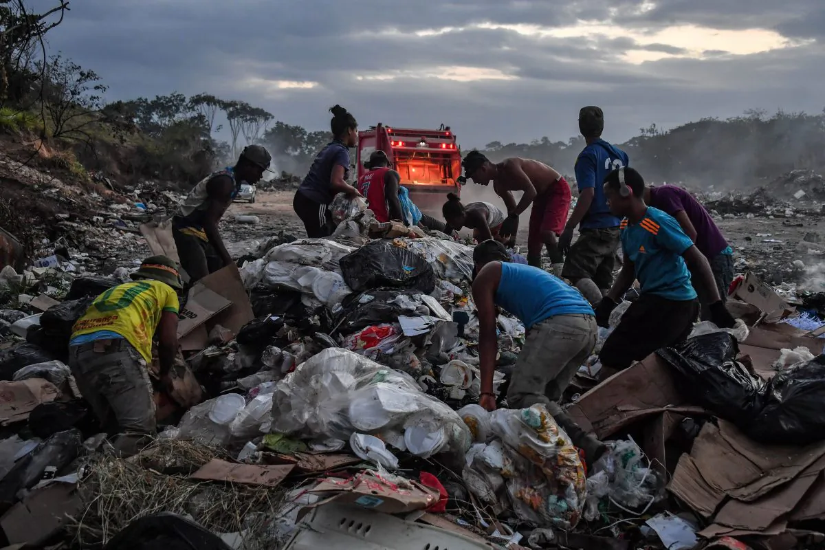 Venezuelan scavengers dig through trash at a landfill, in Pacaraima, Roraima State, Brazil, on the border with Venezuela, on February 28, 2019. (Nelson AlmeidaNELSON ALMEIDA/AFP/Getty Images