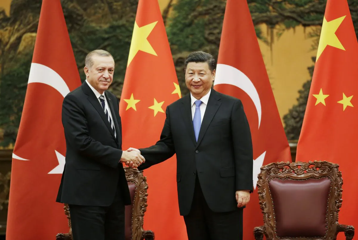 Turkish President Recep Tayyip Erdogan and Chinese leader Xi Jinping attend a signing ceremony in Beijing, China on May 13, 2017. China detained four Turkish businessmen on March 9, 2019. (Jason Lee- Pool/Getty Images)