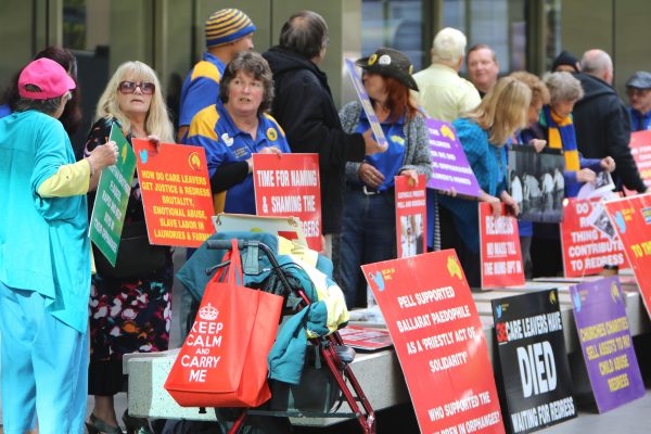 Protesters sat outside the Melbourne court for George Pell