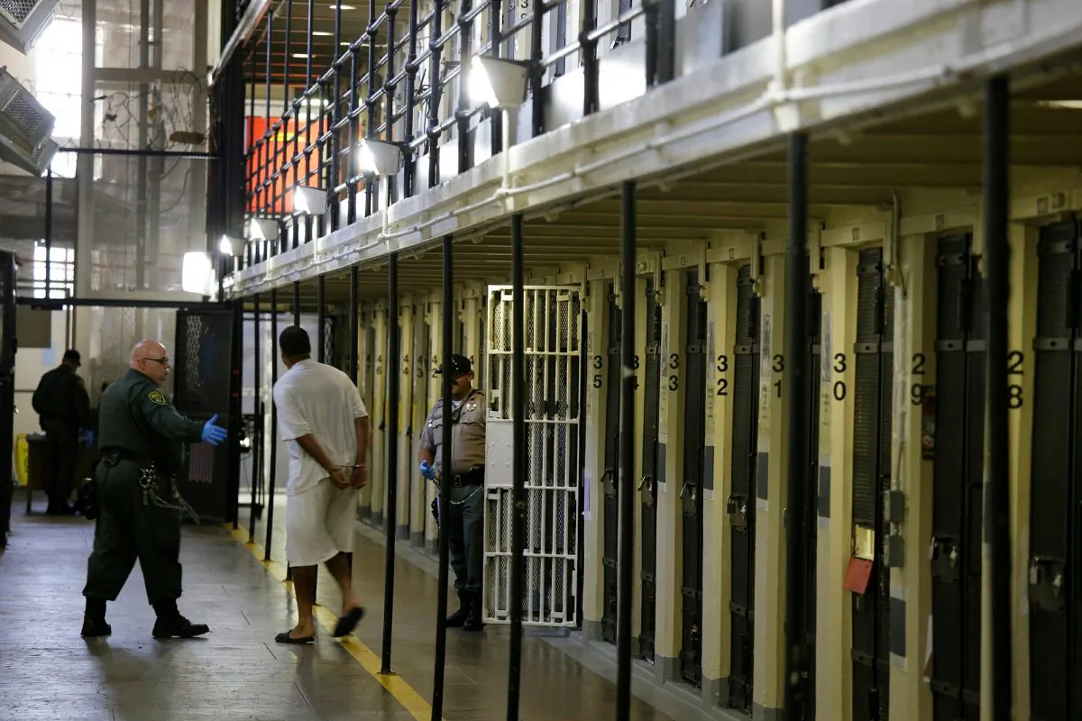 A condemned inmate is led out of his east block cell on death row at San Quentin State Prison, in San Quentin, Calif., on March 13, 2019. (Eric Risberg/AP)