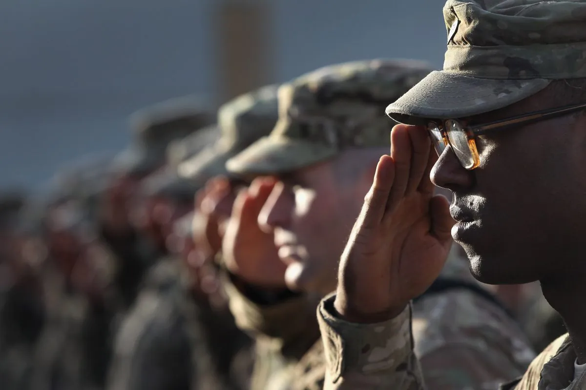U.S. Army soldiers salute during the national anthem during an anniversary ceremony of the Sept. 11 terrorist attacks at Bagram Air Field, Afghanistan, on Sept. 11, 2011. (John Moore/Getty Images)