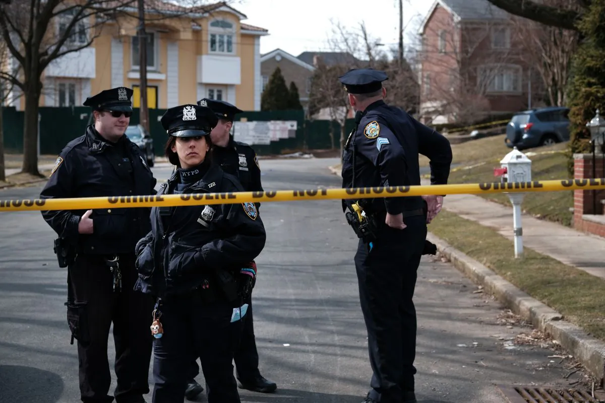 Police stand along the street where reputed mob boss Francesco “Franky Boy” Cali lived and was gunned down on March 14, 2019 in the Todt Hill neighborhood of the Staten Island borough of New York City. (Spencer Platt/Getty Images)
