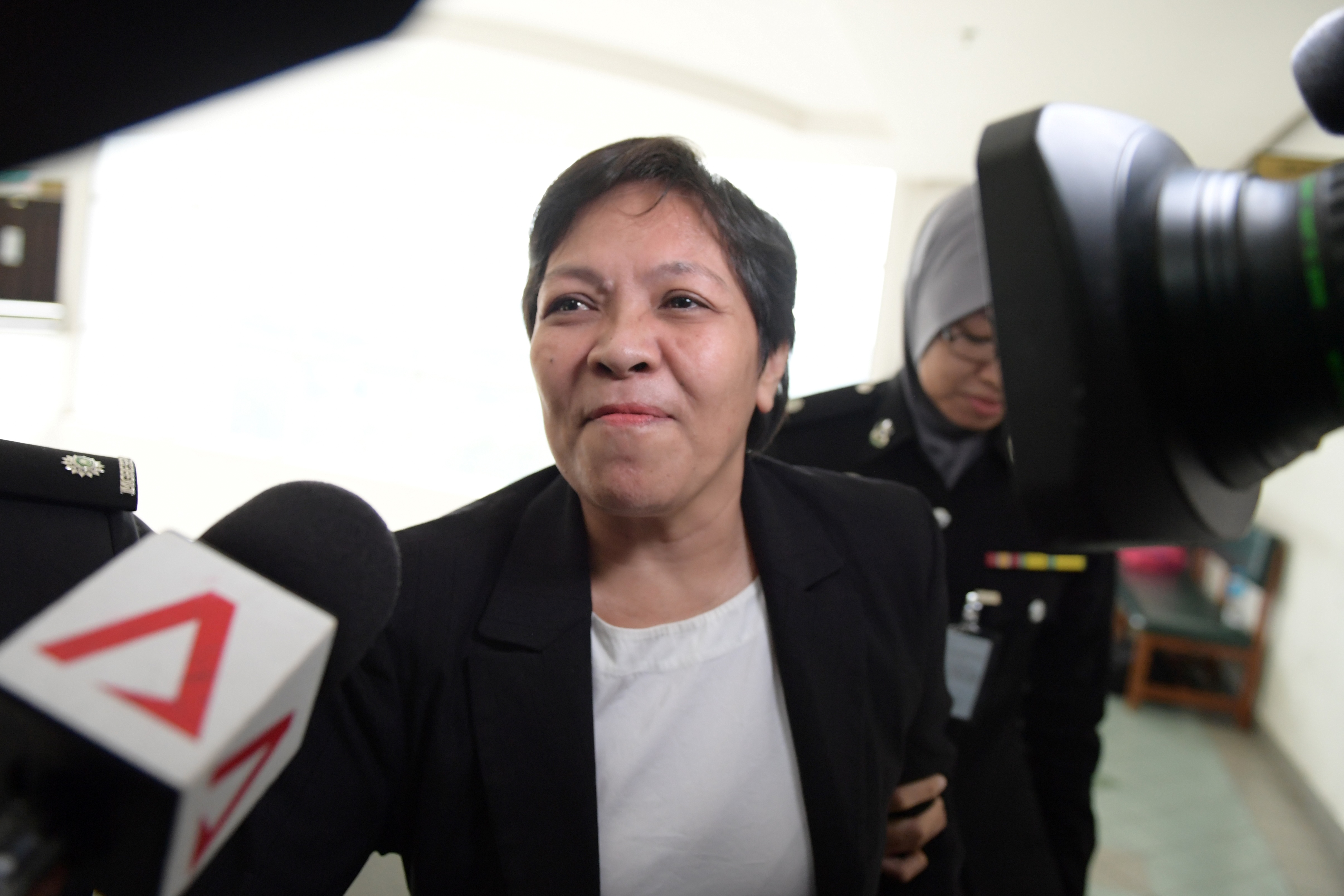 Maria Elvira Pinto Exposto reacts after she was cleared of drug trafficking charges