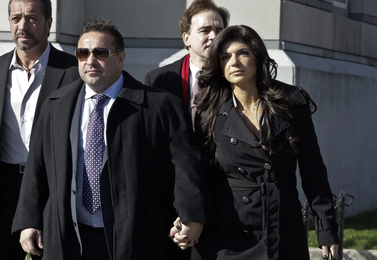 Teresa Giudice and her husband Giuseppe 'Joe' Giudice (L) leave Newark federal court on November 20, 2013 in Newark, New Jersey. Joe finished serving a 41-month prison sentence on March 14, 2019, and was immediately transferred into the custody of Immigration and Customs Enforcement. (Kena Betancur/Getty Images)