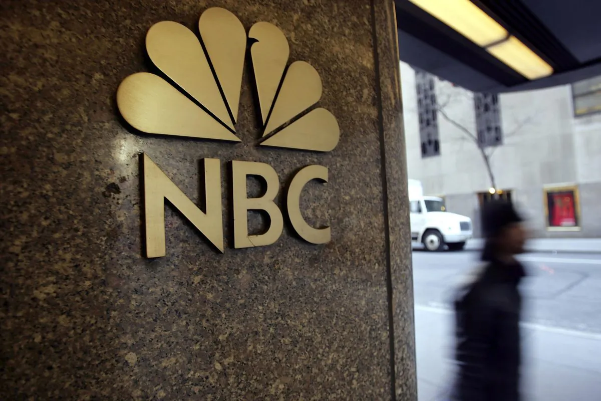 Pedestrians walk past  NBC's headquarters in New York City in a file photograph. (Spencer Platt/Getty Images)