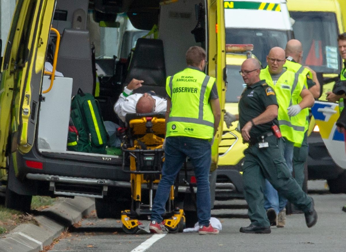an injured person getting loaded into ambulance