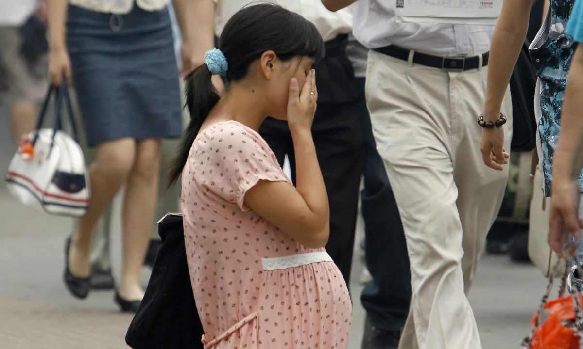 Pregnant woman crying. (TEH ENG KOON/AFP/Getty Images)
